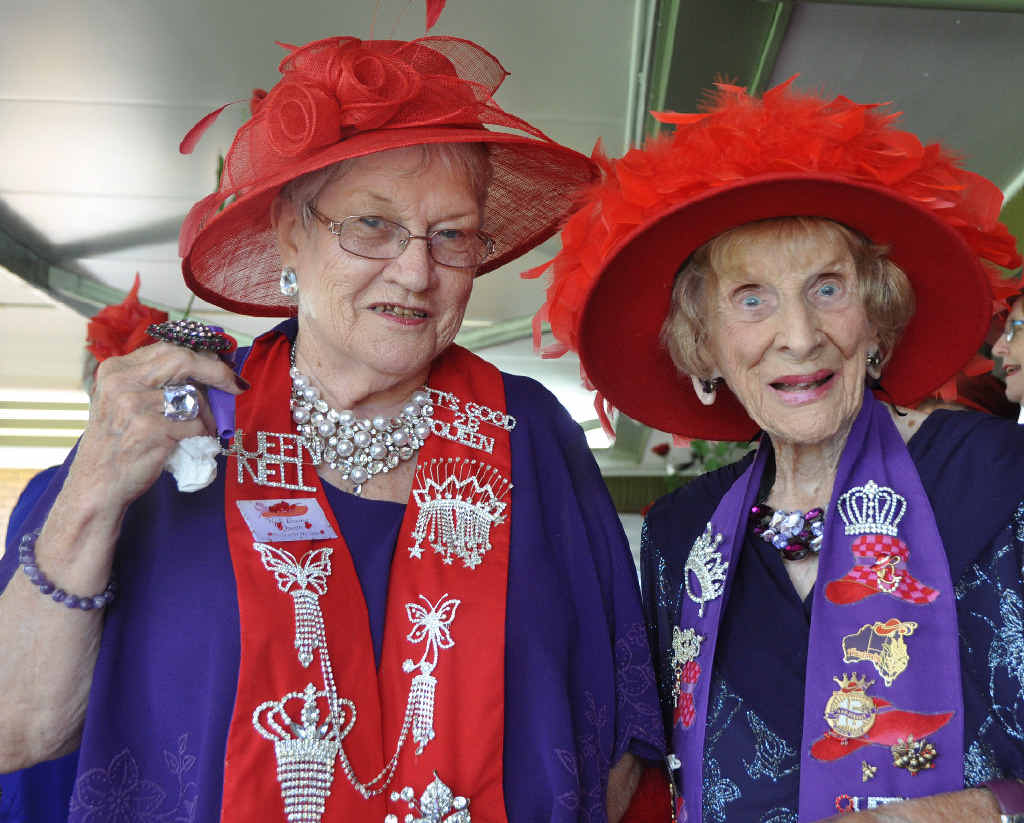 LADY IN RED: Red Hatters Supreme Matriarch Florence Slattery with Queen Nell Evans from the Scarlet Ha’lets, who organised the special celebration at the Golf Club yesterday. LADY IN RED: Red Hatters Supreme Matriarch Florence Slattery with Queen Nell Evans from the Scarlet Ha’lets, who organised the special celebration at the Golf Club yesterday.